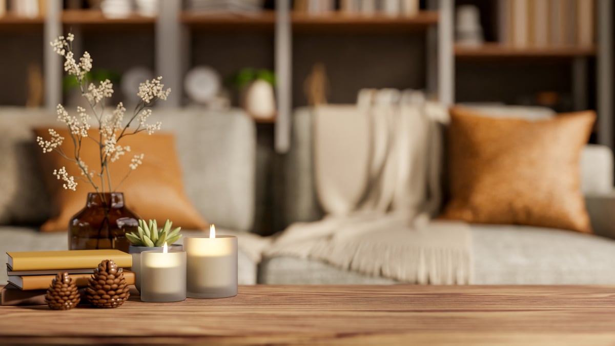 cozy candle with rustic lid on wooden table, warm farmhouse ambiance